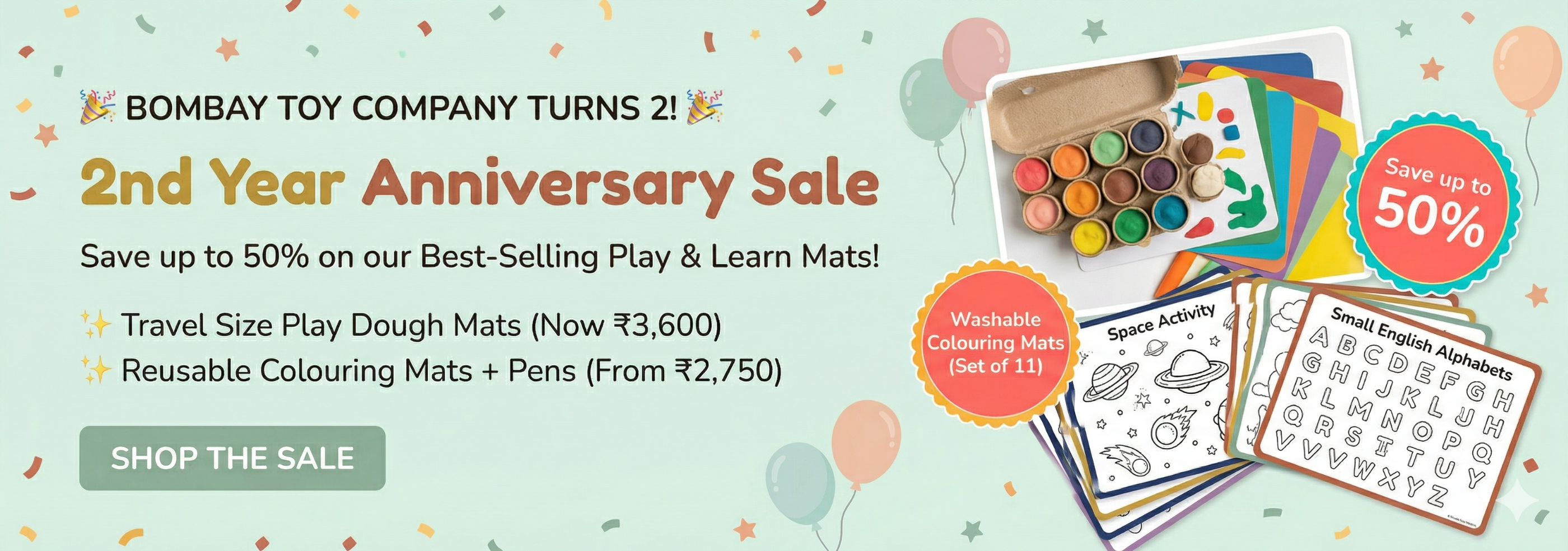 Promotional banner for Bombay Toy Company's 2nd Year Anniversary Sale with play mats and coloring books.